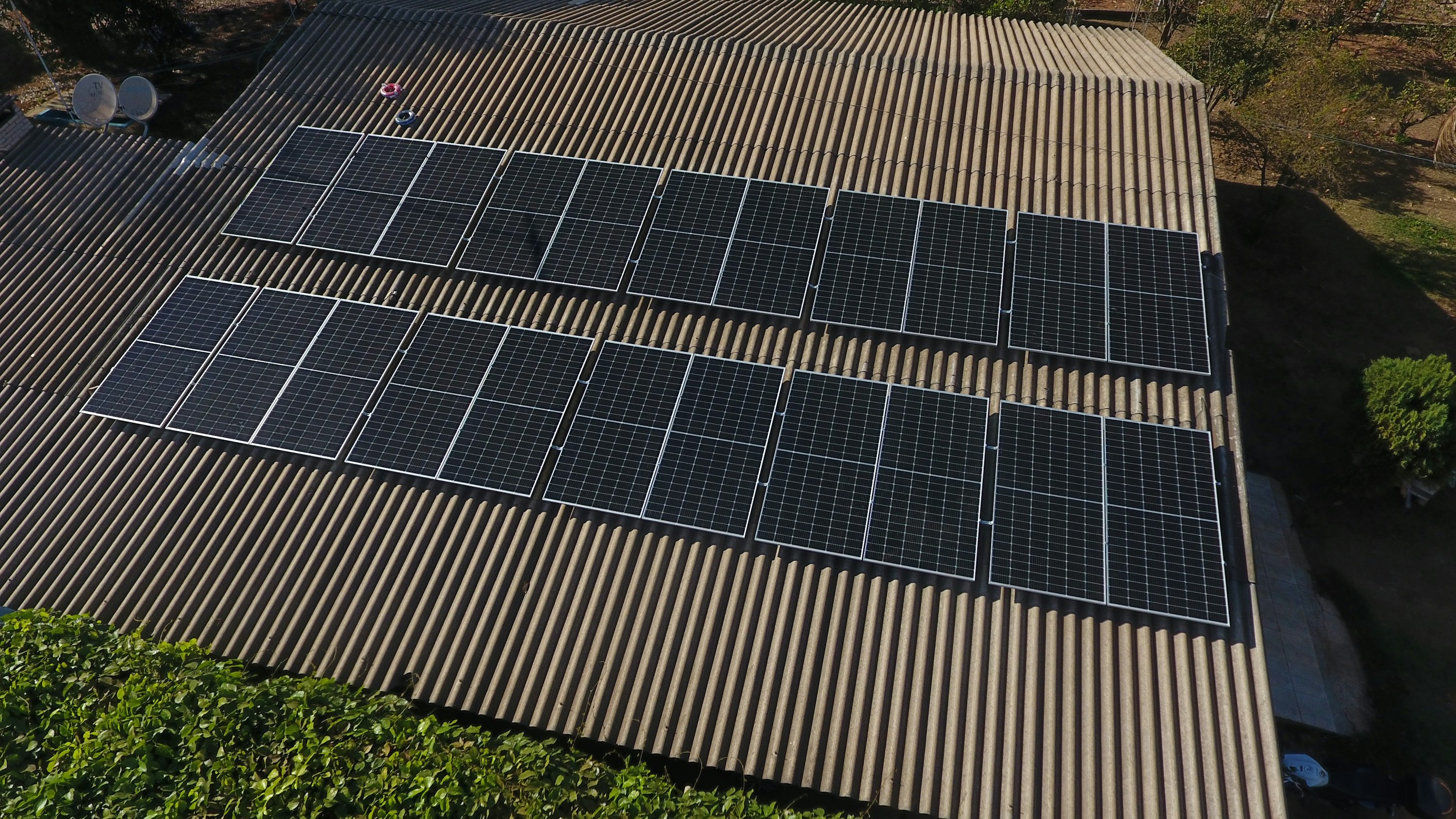 Rows of rooftop solar panels in daylight